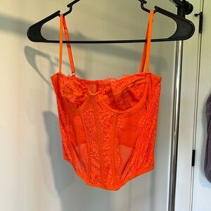 Women’s Urban Outfitters Orange lace corset top.